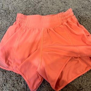 Raspberry cream 4 inch lululemon shorts.